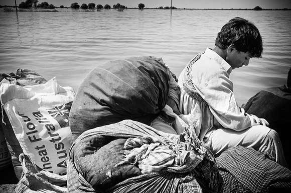 Waiting for boat to bring rations back to village