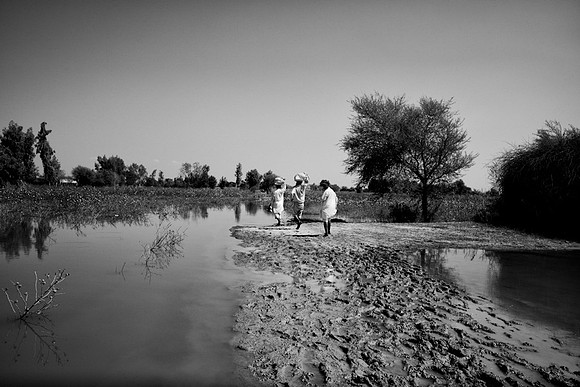 Men bring rations back to their villages