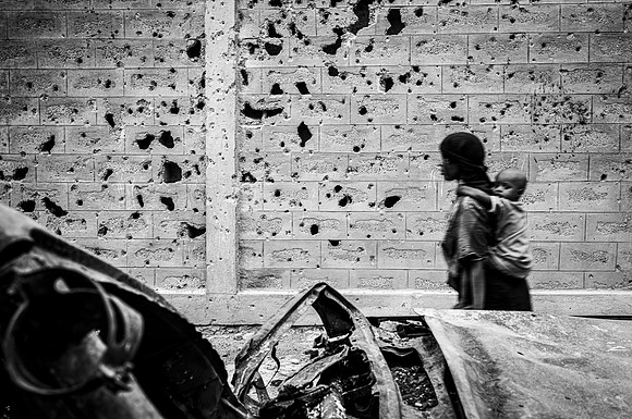 Life continues in amongst artillery shrapnel from the conflict