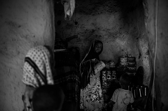 Esha Mohammed lives with her extended family in a flood prone area. She has a husband and 4 children, 2 males and 2 females, two of whom are married.They lead a simple life, grinding maize and cereal